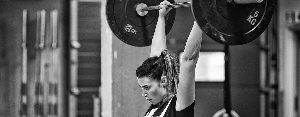 Motivation: image of woman lifting weights; Image by Runar Eilertsen, CC: flickr.com/photos/runare/